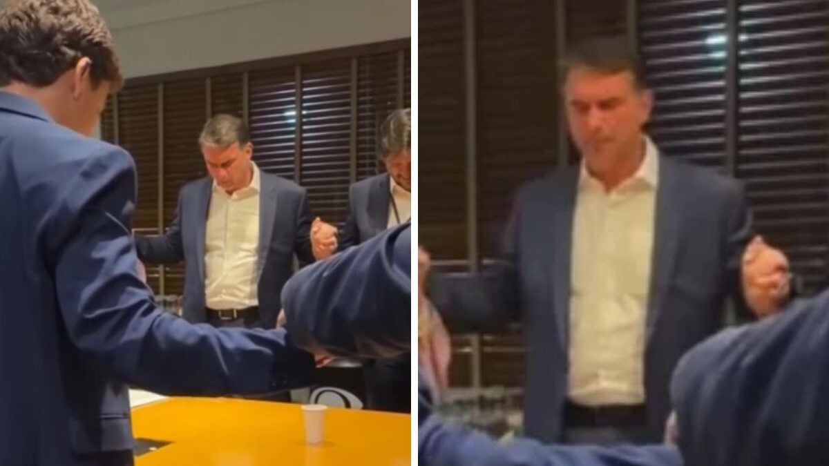 Flávio Bolsonaro reza o Pai-Nosso com apoiadores antes de debate contra Lula na Band